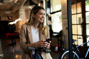Businesswoman in office. Smiling businesswoman using the phone.