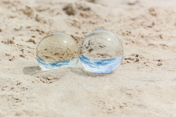 Glass transparent balls on sand