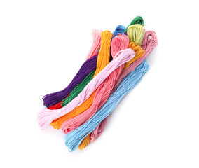 Colorful embroidery floss set on white background, top view