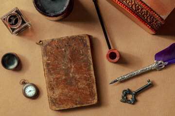 Vintage pipe, notebook, watch and key. Private detective investigation game concept. Overhead flat...