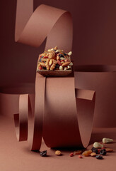 The mix of dried fruits and berries in wooden dish.