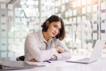 Business concept, Businessman analyzing statistical data and working on laptop in office