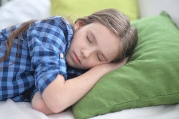 Obraz na płótnie Canvas Cute little girl sleeping in bed at home