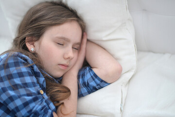 Cute little girl sleeping in bed at home