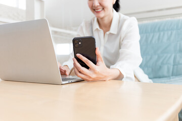 woman work using texting cell phone typing computer.student study education online learning.adult professional chatting on laptop,mobile contact us at Thinking business plan.connecting people concept