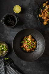 soba with mushrooms on a dark background