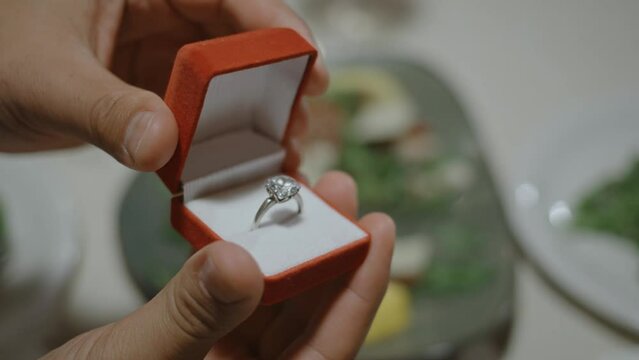 Man proposing marriage to his girlfriend