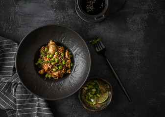soba with mushrooms on a dark background