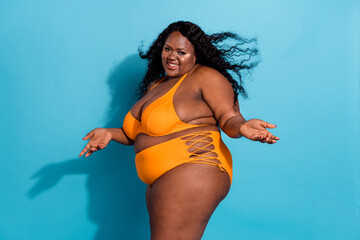 Profile side view portrait of attractive cheerful hot thick woman posing enjoying hair flying...