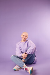 Young woman suffering from cancer laugh smile feel positive about future recovery. Millennial female with shaved head