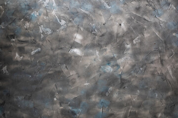 Background of a rough plastered wall in gray and blue colors