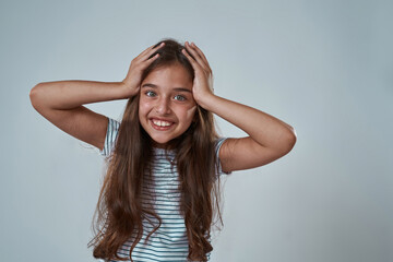 Fototapeta premium Partial image of little girl touching her head