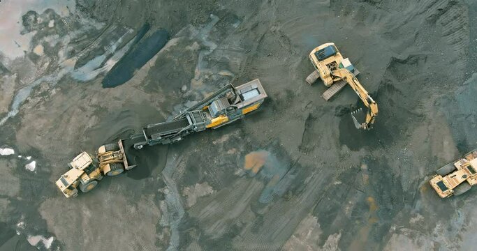 Stone crusher conveyor belt in sorting stone into fraction surface at asphalt mixing plant on panoramic top view