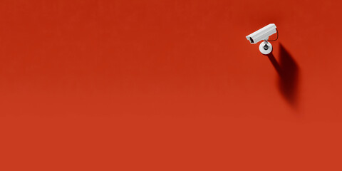 outdoor surveillance camera on a red background, security system