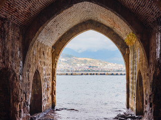Alanya, turkey, winter walk by mediterranean sea. Shipyards and arsenal in Alanya, view of alanya from the shipyard arch