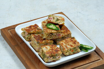 Martabak Telor or Martabak (muttabaq ) Telur. Savory pan-fried pastry stuffed with egg, meat ,vegetable and spices