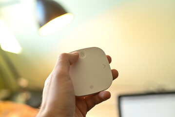 smart lamp - remote remote control of the lamp - hand holding lamp control panel