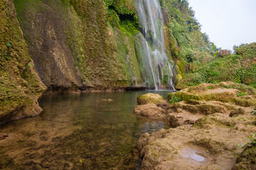 Rocky low angle view of waterfall creek	
