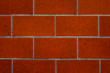 Close up: Dark red tile floor, white cement filling gaps, black spots, German 70s design, texture,...