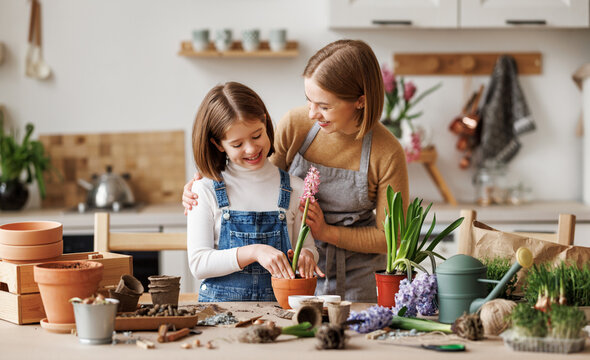 Mom and kid doing home gardening together