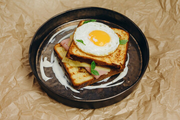 The chef is served two toasts in plate.