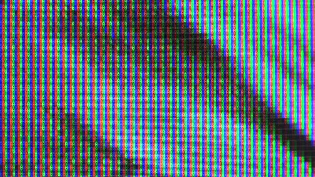 Close up view at a plasma tv while showing television activity.