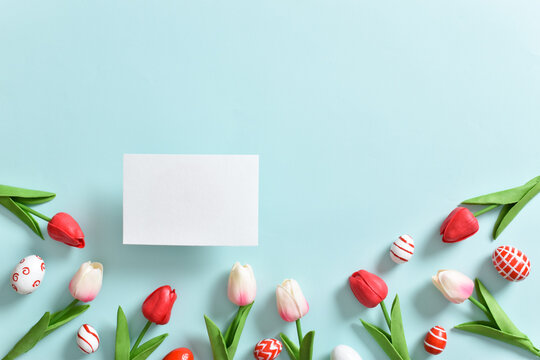 Background with tulip flowers and Easter eggs