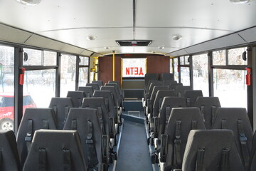 Bus interior with rows of seats