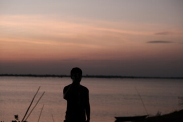 the sun is going down in the evening Gives a faint orange glow in the image.