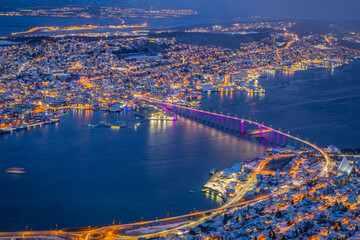 Aerial view of beautiful winter landscape of snow covered town Tromso