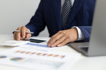 Businessman accountant or banker making calculations. Business Financing Accounting Banking Concept