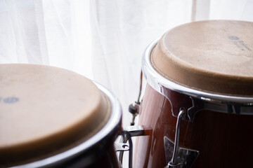 Conga Drum , African conga drum , latin drum , Conga , Fragment of bongs closeup on stage in dark tones