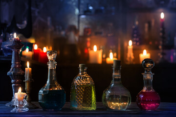 magic potions in bottles on wooden background