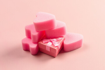 Pink tampons stringless with gift box on pink background. Womens hygiene. Occupation sports and love.