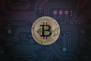 Bitcoin on electronic circuit board. Digital crypto currency concept