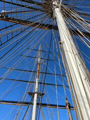 A ship rusty mast with a blue sky