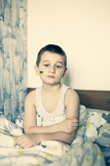 boy protests against the military conflict, cries, worries and is afraid. The crisis. World peace.