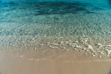 Horizontal background of the crystal clear water in Cala Vidre located in the municipality of Ametlla de Mar, Tarragona, Costa Dorada, Spain.