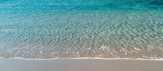 Panoramic background of the crystal clear water in Cala Vidre located in the municipality of...