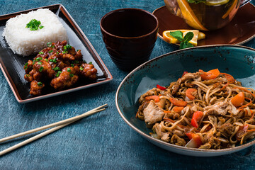 Assorted Chinese food full set. Chinese noodles, fried rice. Famous Chinese cuisine dishes on table