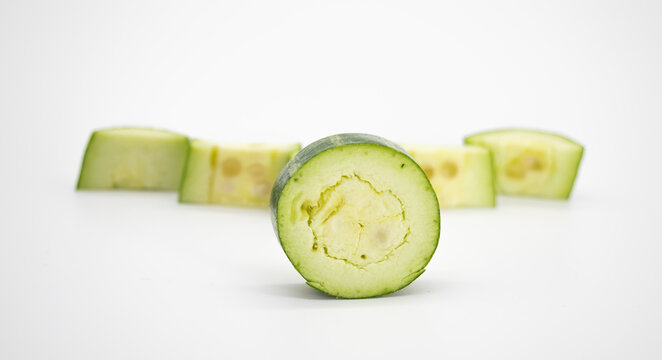 chopped pointed gourd isolated on white background