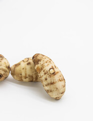 Group of taro roots with one cut in cross sections