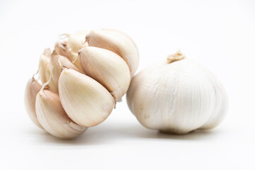 Isolated garlic.. Fresh peeled garlic cloves, bulb with garlic slices isolated on white background. clipping path