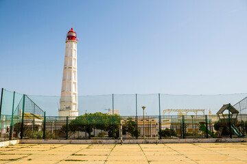 Obraz premium Lighthouse at Farol Island, Faro, Algarve, Portugal