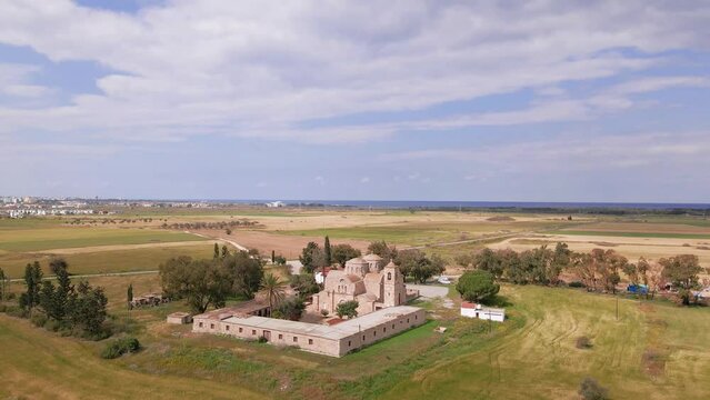 Aerial 4k view of Saint Barnabas Monastery with its surrounding and sea view in Famagusta, North Cyprus
