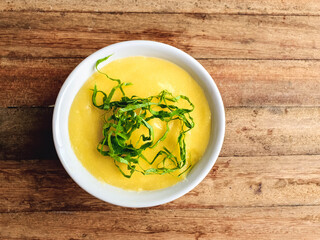  Angú typical Brazilian food with couve  and wooden background and with space for text