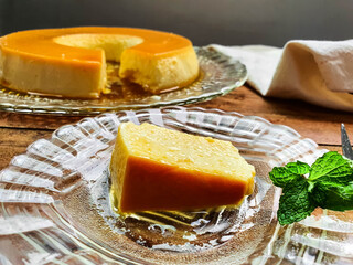typical Brazilian sweet milk pudding slice in glass dish 