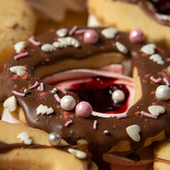 sweet donuts with jam and cream sprinkled with marshmallows, Christmas decoration, close-up, sweet decoration.