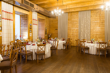 beautifully set tables with glasses and appliances for a wedding or other event