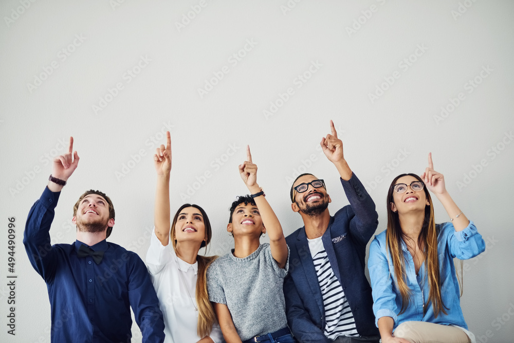 Poster no matter how far it seems, go after your dream. shot of a group of young people pointing towards so